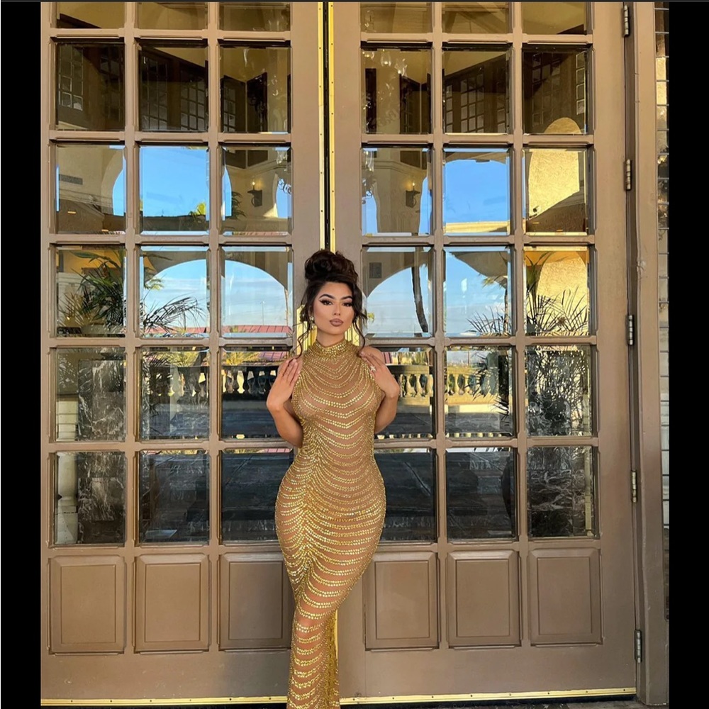 This dress is a gold beaded dress purchased from Alglist. Only worn once